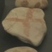 Pre-Christian cross painted on a limestone